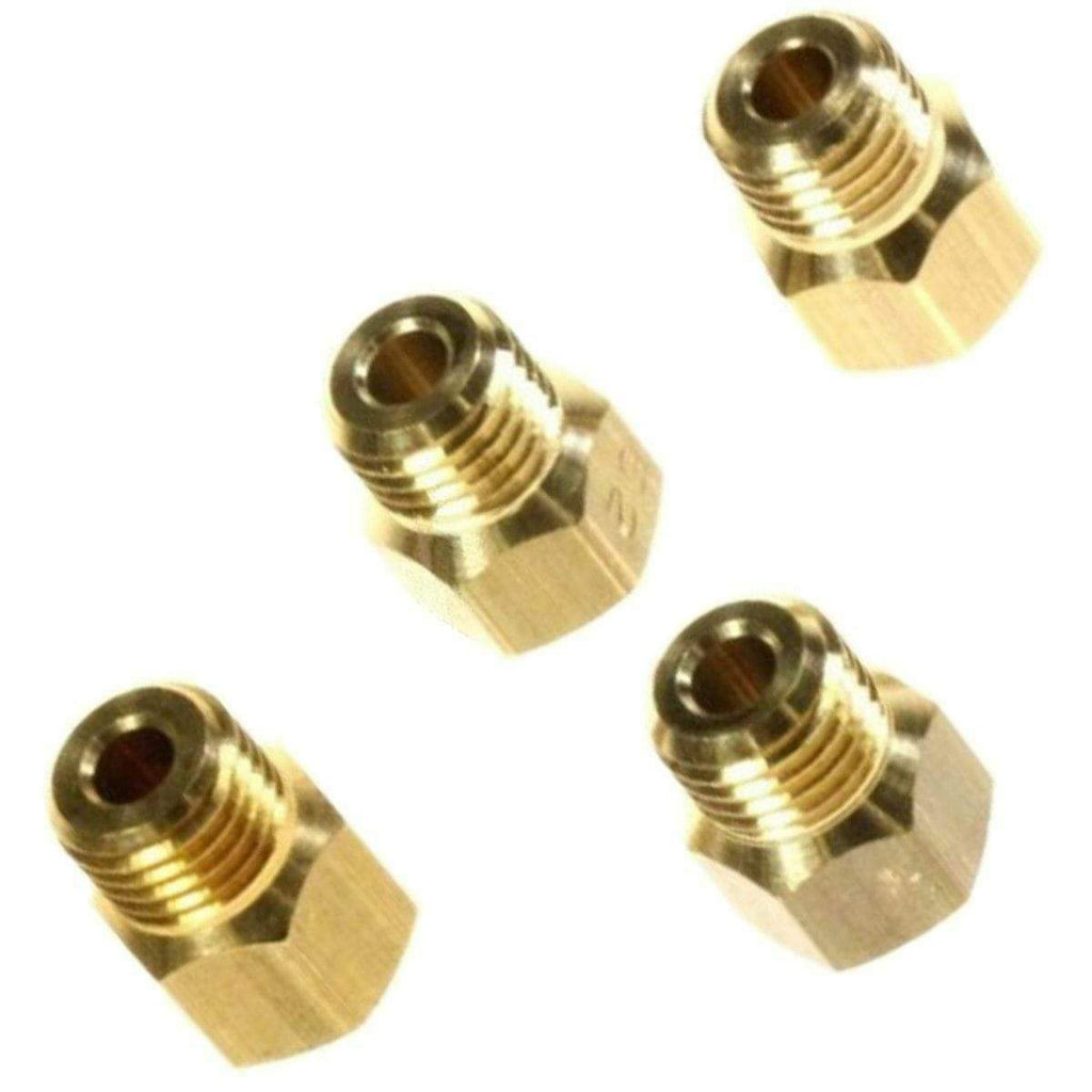 Four gas jets in a neatly arranged layout, designed for use with gas appliances, showcasing various sizes for optimal gas flow.